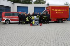 Gruppenfoto zur Einweisung in den MFU 3000 (Quelle: Hartmut Heyde - Feuersozietät Berlin-Brandenburg)